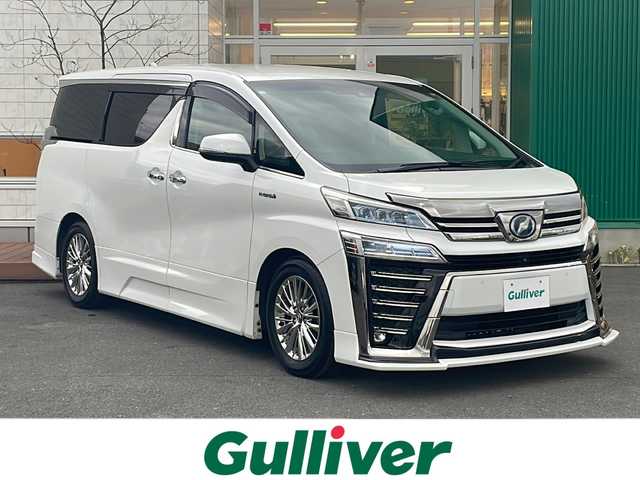 トヨタ ヴェルファイア ハイブリット ZR 青森県 2019(平31)年 11.2万km ホワイトパールクリスタルシャイン 4WD/OP寒冷地仕様/OP JBLプレミアムサウンド/純正SDナビ・フルセグTV/CD・DVD・Bluetooth・SD/OPパノラミックビューモニター/OPデジタルインナーミラー/黒合皮シート/前席エアシート・シートヒーター/両側パワースライドドア/OPパワーバックドア/セーフティセンス/プリクラッシュセーフティ/レーダークルーズコントロール/レーントレーシングアシスト/アダプティブハイビーム/インテリジェントクリアランスソナー/OPブラインドスポットモニター/前後ドライブレコーダー/ワイパーデアイサー/OP AC100V1500W/ビルトインETC2.0/OP3眼LEDヘッドライト/LEDフォグランプ/LEDリアフォグランプ/社外エアロ/社外車高調(純正車内)