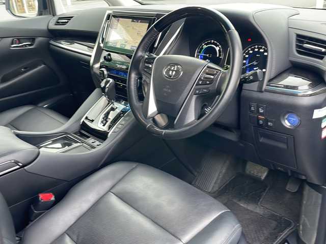 トヨタ ヴェルファイア ハイブリット ZR 青森県 2019(平31)年 11.2万km ホワイトパールクリスタルシャイン 4WD/OP寒冷地仕様/OP JBLプレミアムサウンド/純正SDナビ・フルセグTV/CD・DVD・Bluetooth・SD/OPパノラミックビューモニター/OPデジタルインナーミラー/黒合皮シート/前席エアシート・シートヒーター/両側パワースライドドア/OPパワーバックドア/セーフティセンス/プリクラッシュセーフティ/レーダークルーズコントロール/レーントレーシングアシスト/アダプティブハイビーム/インテリジェントクリアランスソナー/OPブラインドスポットモニター/前後ドライブレコーダー/ワイパーデアイサー/OP AC100V1500W/ビルトインETC2.0/OP3眼LEDヘッドライト/LEDフォグランプ/LEDリアフォグランプ/社外エアロ/社外車高調(純正車内)