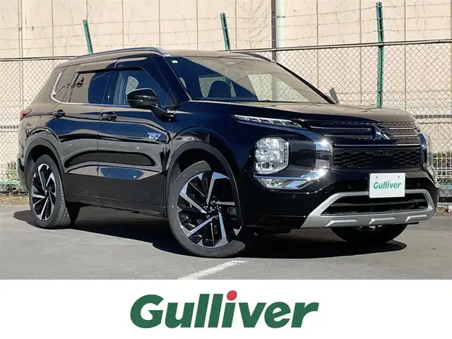 三菱 アウトランダー ＰＨＥＶ P 東京都 2023(令5)年 2.5万km 黒 純正９型ナビ　/サンルーフ　/ＢＯＳＥサウンド　/全周囲カメラ　/追従クルコン　/全席シートヒーター　/パワーシート　/ハンドルヒーター　/電動リア　/置型充電　/AC100V　/パドルシフト　/純正20インチAW　/禁煙