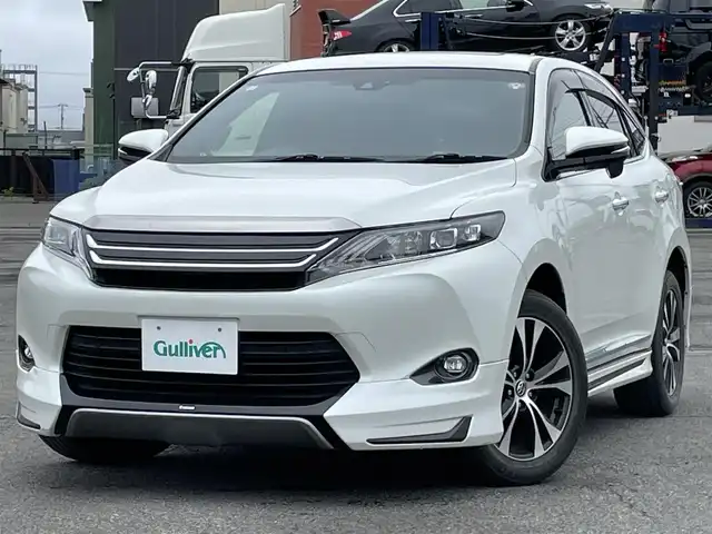 トヨタ ハリアー プレミアム スタイルモーヴ 道央・札幌 2016(平28)年 9万km ホワイトパールクリスタルシャイン サンルーフ/モデリスタエアロ/純正ディーラーOPナビ/CD/DVD/BT/フルセグ/社外後席モニター/横滑り防止装置/クルーズコントロール/レーンキープアシスト/バックカメラ/ビルトインETC/アイドリングストップ/ECOMODE/PWRMODE/パワーバックドア/前席パワーシート/D席メモリーシート/前席シートヒーター/ハーフレザーシート/革巻きウッドコンビステアリング/ステアリングリモコン/MTモード付AT/プッシュスタート/スマートキー/LEDヘッドライト/オートライト/オートハイビーム/フォグランプ/電動格納ミラー/ウィンカーミラー/純正フロアマット/ドアバイザー/社外スピーカー
