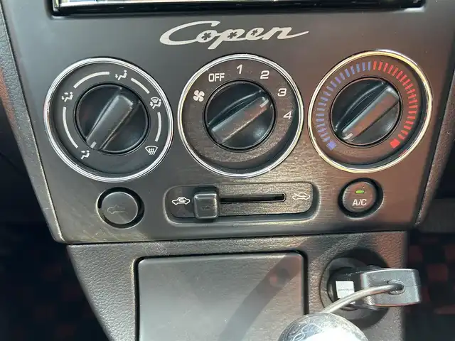 ダイハツ コペン ULTIMATE EDITION 愛知県 2006(平18)年 5.5万km ダークグリーンマイカ オープンカー/メモリーナビ（FM/AM/フルセグTV/USB/BT)/ETC/シートヒーター/純正RECARDシート/純正ビルシュタインショック/純正MOMOステアリング/純正フロアマット/D-SPORTマフラー/カーボンリアスポイラー/ENKEI15インチAW/パワーステアリング/パワーウィンドウ/ABS/ハロゲンライト