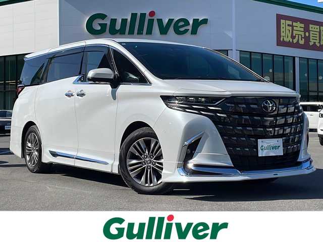 トヨタ アルファード Z 長野県 2024(令6)年 0.8万km プラチナホワイトパールマイカ 純正14型ディスプレイオーディオ/フルセグ/全方位カメラ/モデリスタエアロ/左右独立ムーンルーフ/アドバンストパーク/衝突被害軽減ブレーキ/車線逸脱抑制装置/レーダークルーズコントロール/オートマチックハイビーム/クリアランスソナー/ブラインドスポットモニター/両側電動スライドドア/置くだけ充電/AC100V/ETC2.0/シートヒーター/ベンチレーション/ステアリングヒーター/純正18インチAW/3眼LEDヘッドライト/スマートキー