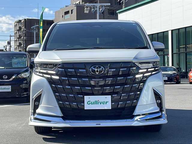 トヨタ アルファード Z 長野県 2024(令6)年 0.8万km プラチナホワイトパールマイカ 純正14型ディスプレイオーディオ/フルセグ/全方位カメラ/モデリスタエアロ/左右独立ムーンルーフ/アドバンストパーク/衝突被害軽減ブレーキ/車線逸脱抑制装置/レーダークルーズコントロール/オートマチックハイビーム/クリアランスソナー/ブラインドスポットモニター/両側電動スライドドア/置くだけ充電/AC100V/ETC2.0/シートヒーター/ベンチレーション/ステアリングヒーター/純正18インチAW/3眼LEDヘッドライト/スマートキー