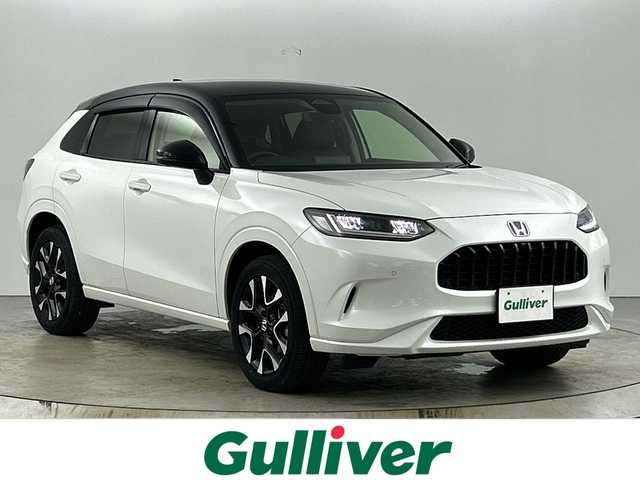 ホンダ ＺＲ－Ｖ ハイブリッド e:HEV Z 愛知県 2023(令5)年 1.2万km プラチナホワイトパール 禁煙車/４WD/純正9インチナビ/（AM/FM/USB/フルセグTV/Bluetooth）/全方位カメラ/BOSEサウンド/ワイヤレス充電/シーケンシャルウインカー/ホンダセンシング/・衝突軽減ブレーキ/・先行車発進お知らせ機能/・レーンキープアシスト/・ブラインドスポットモニター/・標識認識機能/・パーキングセンサー/・レーダークルーズコントロール/・オートマチックハイビーム/ETC2.0/レザーシート/全席シートヒーター/パワーシート/メモリシート/ステアリングヒーター/革巻きステアリング/パワーバックドア/ダウンヒルアシスト/パドルシフト/純正18インチアルミホイール/スマートキー/スペアキー有/プッシュスタート/LEDヘッドライト/オートライト/ワンタッチウインカー/横滑り防止装置/電動格納ミラー