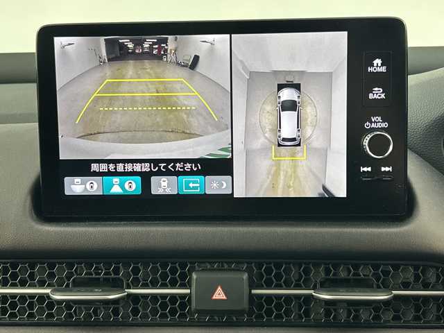 ホンダ ＺＲ－Ｖ ハイブリッド e:HEV Z 愛知県 2023(令5)年 1.2万km プラチナホワイトパール 禁煙車/４WD/純正9インチナビ/（AM/FM/USB/フルセグTV/Bluetooth）/全方位カメラ/BOSEサウンド/ワイヤレス充電/シーケンシャルウインカー/ホンダセンシング/・衝突軽減ブレーキ/・先行車発進お知らせ機能/・レーンキープアシスト/・ブラインドスポットモニター/・標識認識機能/・パーキングセンサー/・レーダークルーズコントロール/・オートマチックハイビーム/ETC2.0/レザーシート/全席シートヒーター/パワーシート/メモリシート/ステアリングヒーター/革巻きステアリング/パワーバックドア/ダウンヒルアシスト/パドルシフト/純正18インチアルミホイール/スマートキー/スペアキー有/プッシュスタート/LEDヘッドライト/オートライト/ワンタッチウインカー/横滑り防止装置/電動格納ミラー