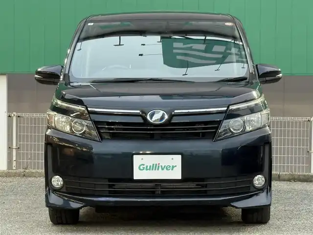 トヨタ ヴォクシー ハイブリッド V 千葉県 2014(平26)年 6.5万km ブラッキッシュアゲハガラスフレーク フリップダウンモニター/バックカメラ/ETC/USB入力端子/両側パワースライドドア/クルーズコントロール/シートヒータ―/純正15インチAW/純正フロアマット/スマートキー