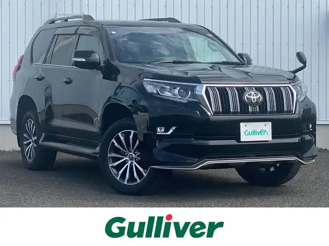 トヨタ ランドクルーザー プラド TX Lパッケージ 熊本県 2021(令3)年 7.9万km ブラック ワンオーナー/保証書・取説あり/社外SDナビＤＴＶ/・CD/DVD/SD/BT/AUX/USB/フルセグ/バックカメラ/社外4本出しマフラー（DOBLEEIGHT）/LEDライト/・オートＨビーム/・フォグ/黒革シート/・シートヒーター/・パワーシート/サンルーフ/ウッドコンビハンドル/サイドステップ/ルーフレール/トヨタセーフティセンス/・ＬＤＡ/・ＰＣＳ/・ＲＳＡ/・先行車発進警報/ＩＳＯＦＩＸ/マット/バイザー/スマートキー/スペアキー×１