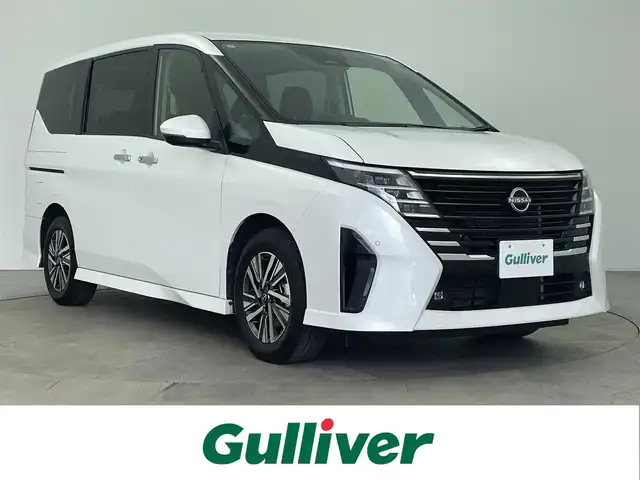 日産 セレナ ハイウェイスター V Vセレクション 大分県 2024(令6)年 1.9万km プリズムホワイト プロパイロット/社外SDナビ/（フルセグ/CD/DVD/Bluetooth）/アルパインフリップダウンモニター/アラウンドビューモニター/オートハイービーム/ETC/両側パワースライドドア/オートブレーキホールド/電動パーキングブレーキ/デジタルインナーミラー/パドルシフト/スマートキー・プッシュスタート/純正アルミホイール　