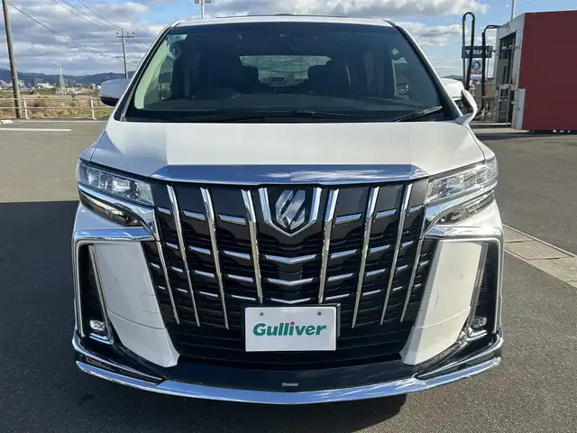 トヨタ アルファード S Cパッケージ 佐賀県 2019(平31)年 6.9万km ホワイトパールクリスタルシャイン ワンオーナー/ツインムーンルーフ/モデリスタエアロ/社外10インチメモリーナビゲーション/・フルセグTV/CD/DVD/SD/USB/Bluetooth/社外11.6インチフリップダウンモニター/バックカメラ/前方ドライブレコーダー/ビルトインETC/デジタルインナーミラー/パワーバックドア/電子パーキングブレーキ/・AUTO HOLD機能/レザーシート(合皮)/DN席＋2列目パワーシート(D席メモリー機能付)/DN席シートヒーター/シートベンチレーション/N席＋2列目電動オットマン/ISOFIX対応/木目調革巻きステアリング/ステアリングヒーター/ステアリングリモコン/純正18インチアルミホイール/純正三眼LEDヘッドライト/・オートマチックハイビーム/純正LEDフォグランプ/純正ドアバイザ―/新車保証書/取扱説明書/スペアキー１本/トヨタセーフティセンス/・レーダークルーズコントロール/・レーントレーシングアシスト/・プリクラッシュセーフティ/・ブラインドスポットモニター/・クリアランスソナー/・パーキングサポートブレーキ/・ロードサインアシスト