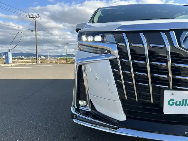 トヨタ アルファード S Cパッケージ 佐賀県 2019(平31)年 6.9万km ホワイトパールクリスタルシャイン ワンオーナー/ツインムーンルーフ/モデリスタエアロ/社外10インチメモリーナビゲーション/・フルセグTV/CD/DVD/SD/USB/Bluetooth/社外11.6インチフリップダウンモニター/バックカメラ/前方ドライブレコーダー/ビルトインETC/デジタルインナーミラー/パワーバックドア/電子パーキングブレーキ/・AUTO HOLD機能/レザーシート(合皮)/DN席＋2列目パワーシート(D席メモリー機能付)/DN席シートヒーター/シートベンチレーション/N席＋2列目電動オットマン/ISOFIX対応/木目調革巻きステアリング/ステアリングヒーター/ステアリングリモコン/純正18インチアルミホイール/純正三眼LEDヘッドライト/・オートマチックハイビーム/純正LEDフォグランプ/純正ドアバイザ―/新車保証書/取扱説明書/スペアキー１本/トヨタセーフティセンス/・レーダークルーズコントロール/・レーントレーシングアシスト/・プリクラッシュセーフティ/・ブラインドスポットモニター/・クリアランスソナー/・パーキングサポートブレーキ/・ロードサインアシスト