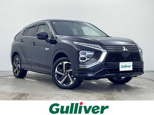 三菱 エクリプス クロス ＰＨＥＶ P 秋田県 2021(令3)年 2.7万km アメジストブラック ４WD/１００V（AC)/純正メモリナビ/TV（フルセグ）/全方位カメラ/三菱e-アシスト/　・衝突被害軽減ブレーキシステム(FCM)/　・車線逸脱警報システム(LDW)/　・レーダークルーズコント　ロール(ACC)/　・オートマチックハイビーム(AHB)/　・誤発進抑制機能(前進＆後退)/　・後側方車両検知警報システム(BSW/LCA)/　・後退時車両検知警報システム(RCTA)/D席パワーシート/シートヒーター/充電ケーブル/スマートキー/ヘッドアップディスプレイ/ステアリングヒーター/純正フロアマット/純正アルミホイール/エアロパーツ（リア）/ABS/横滑防止装置/オートライト（ハイビーム）/ETC/ステアリングリモコン/ドアバイザー
