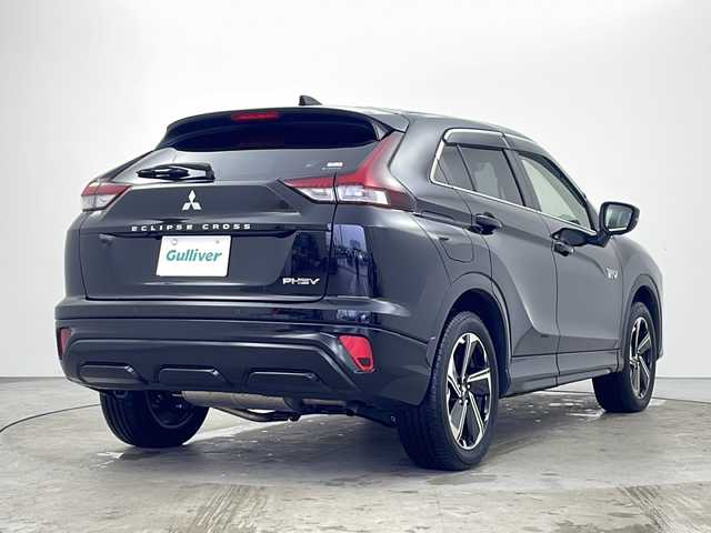 三菱 エクリプス クロス ＰＨＥＶ P 秋田県 2021(令3)年 2.7万km アメジストブラック ４WD/１００V（AC)/純正メモリナビ/TV（フルセグ）/全方位カメラ/三菱e-アシスト/　・衝突被害軽減ブレーキシステム(FCM)/　・車線逸脱警報システム(LDW)/　・レーダークルーズコント　ロール(ACC)/　・オートマチックハイビーム(AHB)/　・誤発進抑制機能(前進＆後退)/　・後側方車両検知警報システム(BSW/LCA)/　・後退時車両検知警報システム(RCTA)/D席パワーシート/シートヒーター/充電ケーブル/スマートキー/ヘッドアップディスプレイ/ステアリングヒーター/純正フロアマット/純正アルミホイール/エアロパーツ（リア）/ABS/横滑防止装置/オートライト（ハイビーム）/ETC/ステアリングリモコン/ドアバイザー
