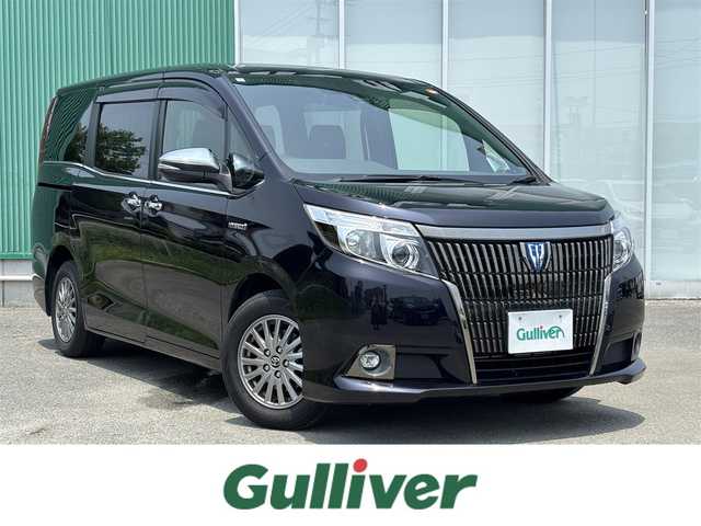 トヨタ エスクァイア ハイブリッド Gi ブラックテーラード 福岡県 2017(平29)年 4.6万km スパークリングブラックパールクリスタルシャイン 11型ALPINE SDナビ/・Bluetooth/・フルセグTV/・バックカメラ/・CD/レーンキープアシスト/盗難防止装置/エアバッグ(W＋サイド)/カーテンエアバッグ/衝突被害軽減システム/社外ドラレコ/ビルトインETC/LEDオートライト/後席用モニター/両側パワスラ/EVモード/POWERモード/WAC/レザーシート/・シートヒーター/・エアシート/純正フロアマット/純正アルミホイール/スマートキー/PW/プッシュスタート