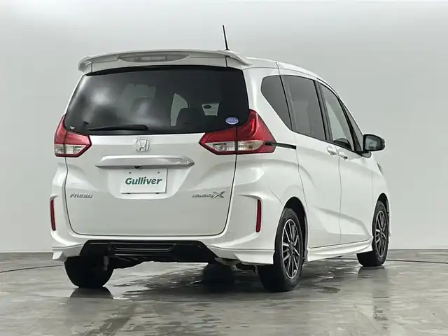 ホンダ フリード モデューロX ホンダセンシング 福島県 2018(平30)年 6.4万km ホワイトオーキッドパール ホンダセンシング　/・CMBS/・車線逸脱警報/・ACC/・レーンアシスト/・歩行者事故低減ステアリング/純正SDナビゲーション/【AM/FM/DVD/CD/Bluetooth/フルセグ】/型番:VXM-187VFNI　/バックカメラ　/ドライブレコーダー　/両側パワースライドドア　/純正フリップダウンモニター　/ハーフレザーシート/プッシュスタート　/・スマートキー　/・スペアキー　/オートライト　/・ＬＥＤライト　/・フォグライト/ステアリングスイッチ/・革巻きステアリング/・チルトステアリング/ETC/ウィンカーミラー