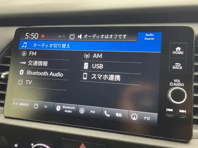 ホンダ フィット e:HEVリュクス 愛知県 2025(令7)年 0.4万km メテオロイドグレーメタリック 純正ナビ/・フルセグ/・Bluetooth/・AppleCarPlay/・AndroidAuto/・AM/FM/アラウンドビューモニター/追従クルコン/ビルドインＥＴＣ2.0/前席シートヒータ/衝突軽減ブレーキ/ブラインドスポットモニター/レーンキープアシスト/ステアリングヒーター/衝突軽減ブレーキ（CMBS）/誤発進抑制機能/歩行者事故低減ステアリング/路外逸脱抑制機能/渋滞追従機能付きアダプティブクルーズコントロール（ACC）/車線維持支援システム（LKAS）/先行車発進お知らせ機能/標識認識機能/オートハイビーム/ワイヤレス充電/電動パーキングブレーキ/オートホールド/LEDヘッドライト