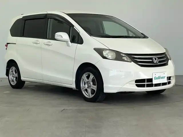 ホンダ フリード G ジャストセレクション 大分県 2011(平23)年 13.1万km プレミアムホワイトパール 社外メモリーナビ/（フルセグ/CD/DVD/Bluetooth）/バックカメラ/片側パワースライドドア/ETC/電動格納ミラー/オートライト/フロアマット