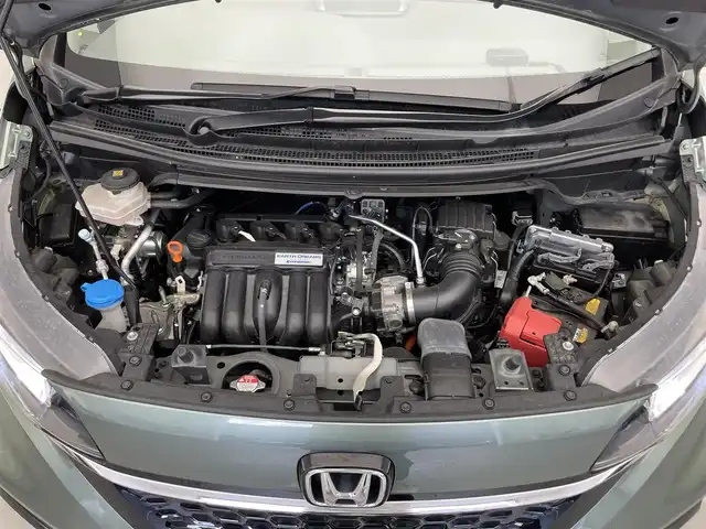 ホンダ フリード ハイブリット G ホンダセンシング 滋賀県 2020(令2)年 7.3万km シルバーミストグリーンM 社外9インチナビ/【Bluetooth/CD/DVD/フルセグTV】/両側パワースライドドア/ホンダセンシング/バックカメラ/追従クルーズコントロール/レーンキープアシスト/リアソナー/衝突軽減ブレーキ/LEDヘッドライト/オートライト/ハーフレザーシート/D/Nシートヒーター/ビルトインETC/プッシュスタート/スマートキー/ステアリングリモコン