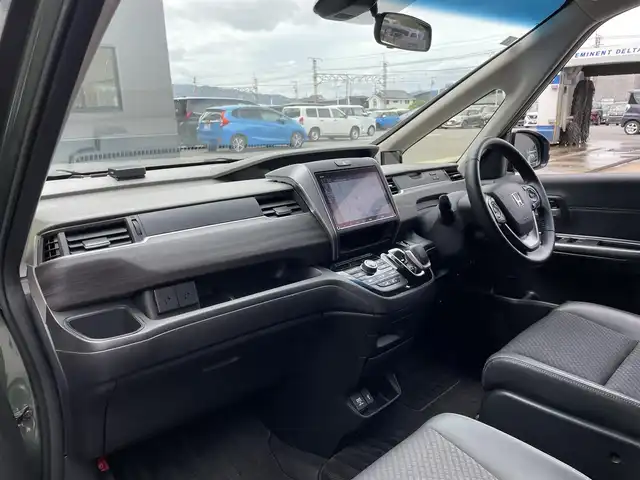 ホンダ フリード ハイブリット G ホンダセンシング 滋賀県 2020(令2)年 7.3万km シルバーミストグリーンM 社外9インチナビ/【Bluetooth/CD/DVD/フルセグTV】/両側パワースライドドア/ホンダセンシング/バックカメラ/追従クルーズコントロール/レーンキープアシスト/リアソナー/衝突軽減ブレーキ/LEDヘッドライト/オートライト/ハーフレザーシート/D/Nシートヒーター/ビルトインETC/プッシュスタート/スマートキー/ステアリングリモコン