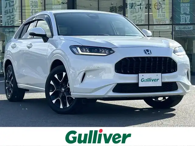 ホンダ ＺＲ－Ｖ ハイブリッド e:HEV Z 岡山県 2023(令5)年 1.6万km プラチナホワイトパール 登録時走行距離15833km/BOSEサウンドシステム/純正ナビ（AM.FM.TV.BT.CarPlay）/全方位カメラ/パワーバックドア/ホンダセンシング/・衝突軽減ブレーキ/・車線維持支援システム/・アダプティブクルーズコントロール/・踏み間違い衝突軽減システム/・ブラインドスポットモニター/・パーキングセンサーシステム/D/N席シートヒーター/D/N席パワーシート/ワイヤレス充電/前後ドライブレコーダー/ステアリングヒーター/LEDヘッドライト