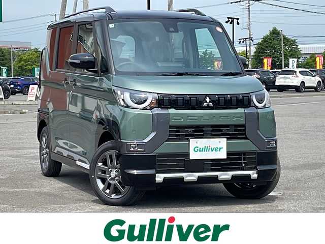 三菱 デリカミニ T プレミアム 道央・札幌 2025(令7)年 0.1万km未満 緑Ｍ ４WD/ワンオーナー/純正ディスプレイオーディオ/AM/FM/BT/MI-PILOT/衝突被害軽減ブレーキ/横滑り防止装置/レーダークルーズコントロール/ダウンヒルアシストコントロール/レーンキープアシスト/クリアランスソナー/マルチアラウンドモニター/デジタルインナーミラー/アイドリングストップ/両側パワースライドドア/前席シートヒーター/ハーフレザーシート/革巻きステアリング/ステアリングリモコン/パドルシフト/ハンドルヒーター/電動パーキング/オートブレーキホールド/プッシュスタート/スマートキー/LEDヘッドライト/オートライト/フォグランプ/ヘッドライトレベライザー/電動格納ミラー/ウィンカーミラー/スペアキー