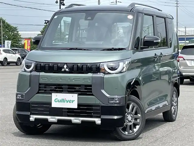 三菱 デリカミニ T プレミアム 道央・札幌 2025(令7)年 0.1万km未満 緑Ｍ ４WD/ワンオーナー/純正ディスプレイオーディオ/AM/FM/BT/MI-PILOT/衝突被害軽減ブレーキ/横滑り防止装置/レーダークルーズコントロール/ダウンヒルアシストコントロール/レーンキープアシスト/クリアランスソナー/マルチアラウンドモニター/デジタルインナーミラー/アイドリングストップ/両側パワースライドドア/前席シートヒーター/ハーフレザーシート/革巻きステアリング/ステアリングリモコン/パドルシフト/ハンドルヒーター/電動パーキング/オートブレーキホールド/プッシュスタート/スマートキー/LEDヘッドライト/オートライト/フォグランプ/ヘッドライトレベライザー/電動格納ミラー/ウィンカーミラー/スペアキー