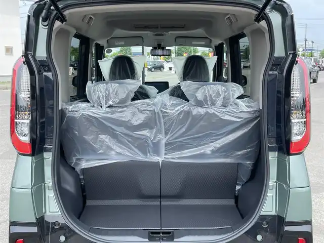 三菱 デリカミニ T プレミアム 道央・札幌 2025(令7)年 0.1万km未満 緑Ｍ ４WD/ワンオーナー/純正ディスプレイオーディオ/AM/FM/BT/MI-PILOT/衝突被害軽減ブレーキ/横滑り防止装置/レーダークルーズコントロール/ダウンヒルアシストコントロール/レーンキープアシスト/クリアランスソナー/マルチアラウンドモニター/デジタルインナーミラー/アイドリングストップ/両側パワースライドドア/前席シートヒーター/ハーフレザーシート/革巻きステアリング/ステアリングリモコン/パドルシフト/ハンドルヒーター/電動パーキング/オートブレーキホールド/プッシュスタート/スマートキー/LEDヘッドライト/オートライト/フォグランプ/ヘッドライトレベライザー/電動格納ミラー/ウィンカーミラー/スペアキー