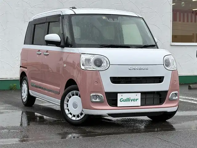 ダイハツ ムーヴ キャンバス ストライプス G 徳島県 2022(令4)年 1.2万km シャイニングホワイトパール/アプリコットピンクメタリック 純正ナビ　NMZK-W72D/（AM/FM/BT/TV/DISC/iPod）/フルセグテレビ/バックカメラ/純正前後ドライブレコーダー/前席シートヒーター/電動パーキング/両側パワースライドドア/ホットカップホルダー/ブレーキホールド機能/ドアバイザー/純正フロアマット/プッシュスタート/スマートキー/衝突被害軽減システム/LEDヘッドライト