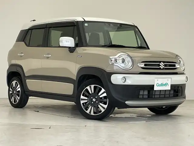 スズキ クロスビー HYBRID MZ 愛知県 2024(令6)年 1.5万km キャラバンアイボリーパールメタリック/ホワイト 2トーンルーフ ・純正SDナビ/＜フルセグ/BT/CD/DVD＞/・全方位モニター/・レーダークルーズコントロール/・パドルシフト/・ETC/・シートヒーター/・アイドリングストップ/・レーンアシスト/・横滑り防止装置/・盗難防止装置/・衝突被害軽減システム /・前後コーナーセンサー/・オートライト/・オートマチックハイビーム/・ステアリングスイッチ/・SRSエアバッグ（運転席/助手席/サイド/カーテン）/・純正１６インチアルミホイール/・LEDヘッドランプ