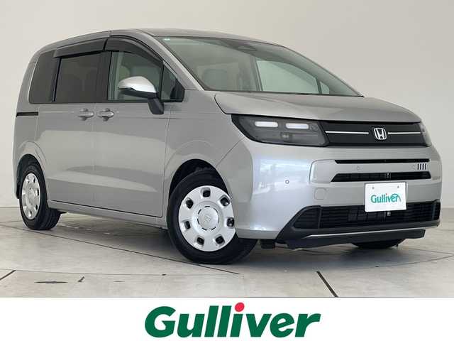 ホンダ フリード ハイブリット e:HEV AIR 愛知県 2025(令7)年 0.3万km ルナシルバーM ホンダセンシング/純正9型ディズプレイオーディオ　ナビ機能なし/両側パワースライドドア/レーダークルーズコントロール/バックカメラ/コーナーセンサー/LEDヘッドライト/レーンキープアシスト/オートマチックハイビーム/ステアリングスイッチ/衝突軽減システム/Bluetooth/スマートキー/プッシュスタート