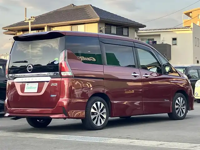 日産 セレナ ハイウェイスター 静岡県 2016(平28)年 6.9万km マルーンレッド 純正ナビ（CD/DVD/BT/フルセグ）/全方位カメラ/プロパイロット/エンジンスタートボタン/取扱説明書/パワーステアリング/パワーウィンドウ/パーキングアシスト/スマートキー/スペアキー1本/Wオートエアコン/レーダークルーズコントロール/純正後席モニター/USB入力端子/ETC/三列シート/ドライブレコーダー前後/ウォークスルー/純正フロアマット/布シート/両側パワースライドドア/純正アルミホイール/ABS/横滑り防止装置/コーナーセンサー前後/レーンキープアシスト/オートライト/LED/W+サイドエアバッグ/衝突軽減システム/デジタルインナーミラー