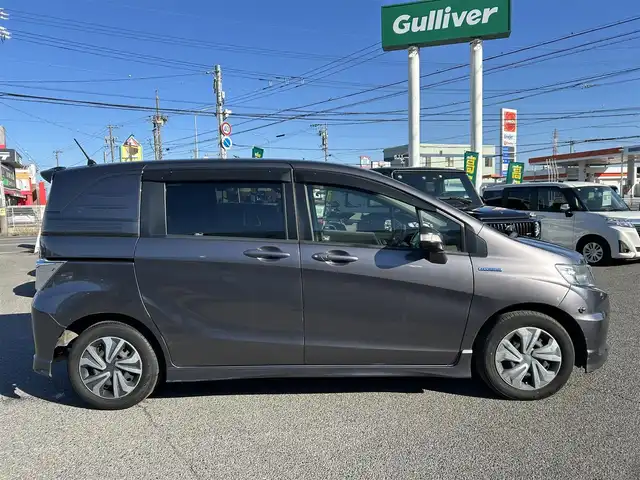 ホンダ フリード スパイク ハイブリット ジャストセレクション 愛知県 2012(平24)年 9.1万km モダンスティールM /禁煙//黒半革シート//純正フリップダウンモニター//純正ナビ//CD/DVD/BT/MSV/USB/地デジTV//バックカメラ//ドライブレコーダー//ETC//両側パワースライドドア//クルーズコントロール//LEDオートライト//革巻きステアリング//ステアリングスイッチ//横滑り防止装置//盗難防止装置//電動格納ウインカーミラー//バニティミラー//純正フロアマット//ドアバイザー//ホイールキャップ//スペアスマートキー//新車時保証書//取扱説明書