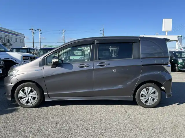 ホンダ フリード スパイク ハイブリット ジャストセレクション 愛知県 2012(平24)年 9.1万km モダンスティールM /禁煙//黒半革シート//純正フリップダウンモニター//純正ナビ//CD/DVD/BT/MSV/USB/地デジTV//バックカメラ//ドライブレコーダー//ETC//両側パワースライドドア//クルーズコントロール//LEDオートライト//革巻きステアリング//ステアリングスイッチ//横滑り防止装置//盗難防止装置//電動格納ウインカーミラー//バニティミラー//純正フロアマット//ドアバイザー//ホイールキャップ//スペアスマートキー//新車時保証書//取扱説明書