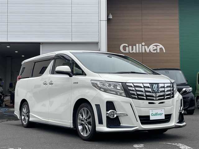 トヨタ アルファードハイブリット G 道央・札幌 2015(平27)年 7.8万km ラグジュアリーホワイトパールクリスタルシャインガラスフレーク 　4　W　D　/WALDフルエアロ/JBLプレミアムサウンド/サンルーフ/純正メーカーナビ/(AM/FM/CD/DVD/BT)/フルセグ(走行中視聴可能)/全方位モニター/パワーバックドア/両側パワースライドドア/純正フリップダウンモニター/前後ドライブレコーダー/コーナーセンサー/ステアリングスイッチ/プリクラッシュセーフティ/運転席パワーシート/オットマン/ETC/ドアバイザー/ウインカーミラー/自動防眩ミラー/オートブレーキホールド/オートライト/フォグランプ