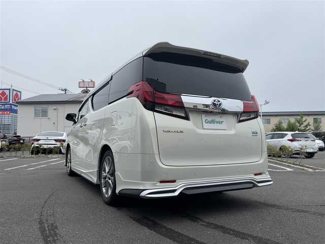 トヨタ アルファードハイブリット G 道央・札幌 2015(平27)年 7.8万km ラグジュアリーホワイトパールクリスタルシャインガラスフレーク 　4　W　D　/WALDフルエアロ/JBLプレミアムサウンド/サンルーフ/純正メーカーナビ/(AM/FM/CD/DVD/BT)/フルセグ(走行中視聴可能)/全方位モニター/パワーバックドア/両側パワースライドドア/純正フリップダウンモニター/前後ドライブレコーダー/コーナーセンサー/ステアリングスイッチ/プリクラッシュセーフティ/運転席パワーシート/オットマン/ETC/ドアバイザー/ウインカーミラー/自動防眩ミラー/オートブレーキホールド/オートライト/フォグランプ