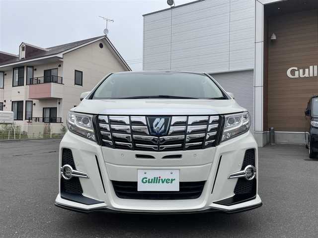 トヨタ アルファードハイブリット G 道央・札幌 2015(平27)年 7.8万km ラグジュアリーホワイトパールクリスタルシャインガラスフレーク 　4　W　D　/WALDフルエアロ/JBLプレミアムサウンド/サンルーフ/純正メーカーナビ/(AM/FM/CD/DVD/BT)/フルセグ(走行中視聴可能)/全方位モニター/パワーバックドア/両側パワースライドドア/純正フリップダウンモニター/前後ドライブレコーダー/コーナーセンサー/ステアリングスイッチ/プリクラッシュセーフティ/運転席パワーシート/オットマン/ETC/ドアバイザー/ウインカーミラー/自動防眩ミラー/オートブレーキホールド/オートライト/フォグランプ