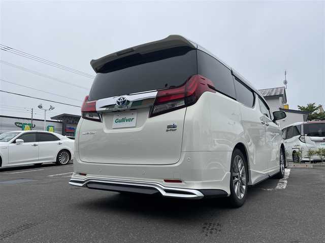 トヨタ アルファードハイブリット G 道央・札幌 2015(平27)年 7.8万km ラグジュアリーホワイトパールクリスタルシャインガラスフレーク 　4　W　D　/WALDフルエアロ/JBLプレミアムサウンド/サンルーフ/純正メーカーナビ/(AM/FM/CD/DVD/BT)/フルセグ(走行中視聴可能)/全方位モニター/パワーバックドア/両側パワースライドドア/純正フリップダウンモニター/前後ドライブレコーダー/コーナーセンサー/ステアリングスイッチ/プリクラッシュセーフティ/運転席パワーシート/オットマン/ETC/ドアバイザー/ウインカーミラー/自動防眩ミラー/オートブレーキホールド/オートライト/フォグランプ