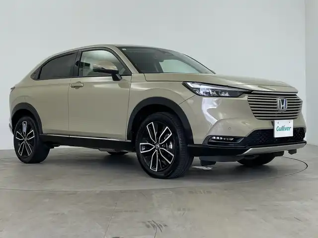 ホンダ ヴェゼル ハイブリッド e:HEV Z 鹿児島県 2021(令3)年 1.8万km ダークモカパール ホンダセンシング/衝突軽減ブレーキ/レーンキープアシスト/レーダークルーズコントロール/オートマチックハイビーム/先行車発進お知らせ機能/標識認識機能/前後コーナーセンサー/ワンオーナー/純正9インチナビ/(BT/AM/FM/Applecraplay/Androidauto/フルセグTV)/禁煙車/純正ビルトインETC2.0/パワーバックドア/ワイヤレス充電/アイドリングストップ/スペアキー/バックカメラ/全方位カメラ/純正18インチアルミホイール/純正フロアマット/純正ラゲッジマット/純正LEDヘッドライト/保証書/取扱説明書