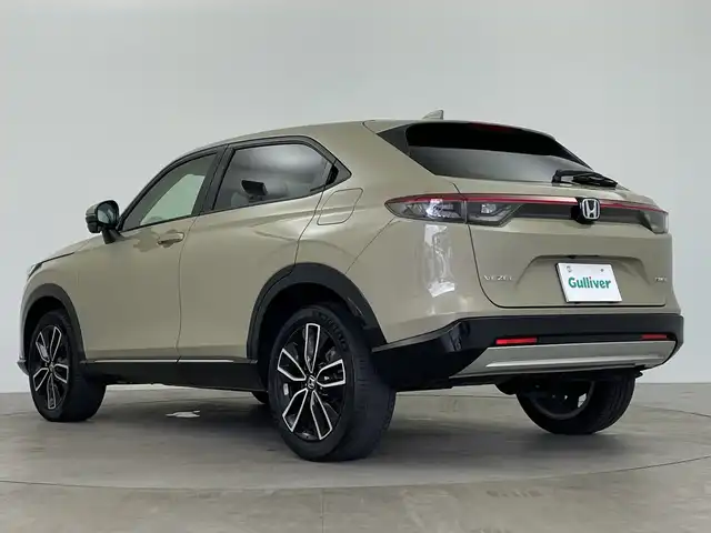 ホンダ ヴェゼル ハイブリッド e:HEV Z 鹿児島県 2021(令3)年 1.8万km ダークモカパール ホンダセンシング/衝突軽減ブレーキ/レーンキープアシスト/レーダークルーズコントロール/オートマチックハイビーム/先行車発進お知らせ機能/標識認識機能/前後コーナーセンサー/ワンオーナー/純正9インチナビ/(BT/AM/FM/Applecraplay/Androidauto/フルセグTV)/禁煙車/純正ビルトインETC2.0/パワーバックドア/ワイヤレス充電/アイドリングストップ/スペアキー/バックカメラ/全方位カメラ/純正18インチアルミホイール/純正フロアマット/純正ラゲッジマット/純正LEDヘッドライト/保証書/取扱説明書