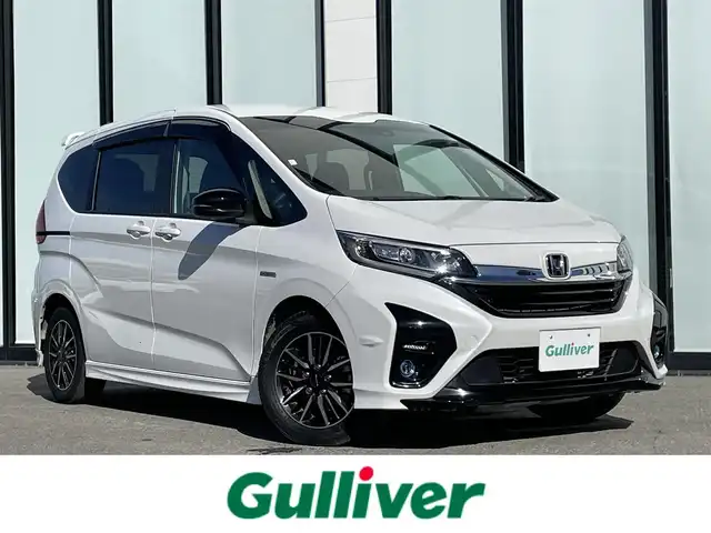 ホンダ フリード ハイブリット モデューロX ホンダセンシング 大阪府 2021(令3)年 3.2万km プラチナホワイトパール 純正ナビ /・フルセグTV BT/USB/DVD /ホンダセンシング /バックカメラ /ETC /両側パワースライドドア /純正フロアマット /ハーフレザーシート /純正15インチAW /LEDヘッド・フォグ /スペアキー/保証書・取説