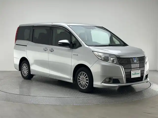 トヨタ エスクァイア ハイブリッド Xi 兵庫県 2015(平27)年 8万km シルバーM 純正ナビ(CD/DVD/SD/Bluetooth/フルセグTV)/バックカメラ/両側パワースライドドア/シートヒーター/フリップダウンモニター/純正フロアマット/LEDヘッドライト/オートライト/ドライブレコーダー/ビルトインETC/スマートキー/プッシュスタート