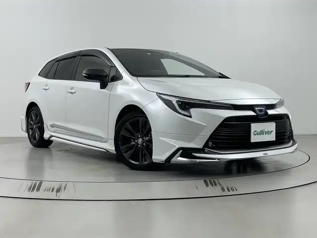 トヨタ カローラツーリング ハイブリッド ダブルバイビー 埼玉県 2023(令5)年 2.9万km プラチナホワイトパールマイカ モデリスタエアロ　/純正ナビ　/　(フルセグ/AM/FM/Bluetooth)　/ビルトインＥＴＣ２．０　/ステアリングヒーター　/トヨタセーフティセンス　/レーンディパーチャーアラート　/ブラインドスポットモニター　/プリクラッシュセーフティ/プロアクティブドライビングアシスト/リヤクロストラフィックアラート/パーキングサポートブレーキ/安心降車アシスト機能/ロードサインアシスト