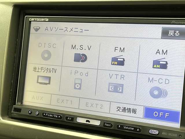 ホンダ フリード ハイブリット ジャストセレクション 千葉県 2012(平24)年 6.4万km スーパープラチナメタリック 社外ナビ/フルセグTV/両側パワースライドドア/バックカメラ/フリップダウンモニター/HIDヘッドライト/ETC/ハーフレザーシート/クルーズコントロール/横滑り防止装置