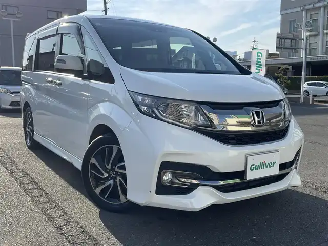 ホンダ ステップワゴン スパーダ クールスピリット 静岡県 2017(平29)年 8.6万km ホワイトオーキッドパール ワンオーナー/ホンダセンシング/・衝突軽減ブレーキ（CMBS）/・踏み間違い衝突軽減システム/・歩行者事故低減ステアリング/・路外逸脱抑制機能/・先行車発進お知らせ機能/・標識認識機能/・渋滞追従機能付アダプティブクルーズコントロール（ACC）/・トラフィックジャムアシスト（渋滞運転支援機能）/・車線維持支援システム（LKAS）/両側パワースライドドア/フリップダウンモニター/純正メモリナビ/・フルセグ/Bluetooth/SD/CD/DVD/バックカメラ/ステアリングリモコン/前席シートヒーター/カーテンエアバック/パドルシフト/2列目サンシェード/2列目シートバックテーブル/ドアバイザー/ＥＴＣ/純正フロアマット/純正１７インチＡＷ/新車時保証書/取扱説明書