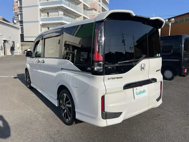 ホンダ ステップワゴン スパーダ クールスピリット 静岡県 2017(平29)年 8.6万km ホワイトオーキッドパール ワンオーナー/ホンダセンシング/・衝突軽減ブレーキ（CMBS）/・踏み間違い衝突軽減システム/・歩行者事故低減ステアリング/・路外逸脱抑制機能/・先行車発進お知らせ機能/・標識認識機能/・渋滞追従機能付アダプティブクルーズコントロール（ACC）/・トラフィックジャムアシスト（渋滞運転支援機能）/・車線維持支援システム（LKAS）/両側パワースライドドア/フリップダウンモニター/純正メモリナビ/・フルセグ/Bluetooth/SD/CD/DVD/バックカメラ/ステアリングリモコン/前席シートヒーター/カーテンエアバック/パドルシフト/2列目サンシェード/2列目シートバックテーブル/ドアバイザー/ＥＴＣ/純正フロアマット/純正１７インチＡＷ/新車時保証書/取扱説明書