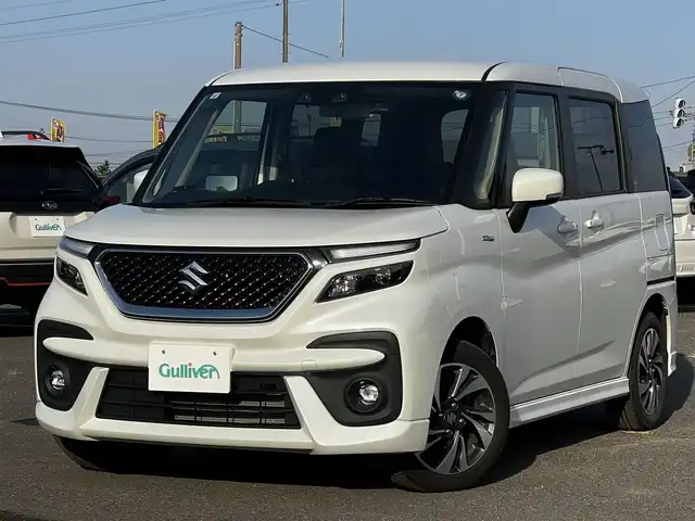 スズキ ソリオ バンディット HV MV 道央・札幌 2024(令6)年 1.5万km ピュアホワイトP ４WD/社外メモリーナビ/AM/FM/BT/スズキセーフティサポート/衝突被害軽減ブレーキ/横滑り防止装置/レーダークルーズコントロール/レーンキープアシスト/クリアランスソナー/バックカメラ/ETC/ドライブレコーダー/アイドリングストップ/両側パワースライドドア/前席シートヒーター/革巻きステアリング/ステアリングリモコン/プッシュスタート/スマートキー/LEDヘッドライト/オートライト/オートマチックハイビーム/フォグランプ/電動格納ミラー/ヒーテッドドアミラー/ウィンカーミラー/社外フロアマット/スペアキー