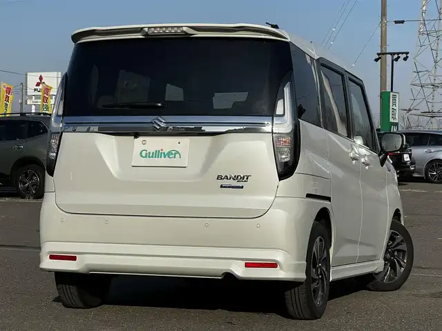 スズキ ソリオ バンディット HV MV 道央・札幌 2024(令6)年 1.5万km ピュアホワイトP ４WD/社外メモリーナビ/AM/FM/BT/スズキセーフティサポート/衝突被害軽減ブレーキ/横滑り防止装置/レーダークルーズコントロール/レーンキープアシスト/クリアランスソナー/バックカメラ/ETC/ドライブレコーダー/アイドリングストップ/両側パワースライドドア/前席シートヒーター/革巻きステアリング/ステアリングリモコン/プッシュスタート/スマートキー/LEDヘッドライト/オートライト/オートマチックハイビーム/フォグランプ/電動格納ミラー/ヒーテッドドアミラー/ウィンカーミラー/社外フロアマット/スペアキー