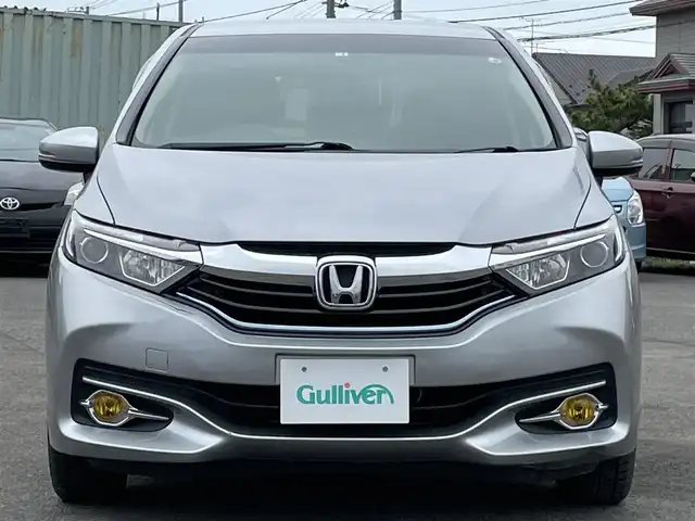ホンダ シャトル ハイブリッド 道央・札幌 2018(平30)年 7.7万km ルナシルバーM ４WD/社外オーディオ/AM/FM/USB/AUX/横滑り防止装置/ビルトインETC/ECONモード/Sモード/ワイパーデアイサー/EVMODE/プッシュスタート/スマートキー/ハロゲンヘッドライト/フォグランプ/ヘッドライトレベライザー/電動格納ミラー/ヒーテッドドアミラー/ウィンカーミラー/フロアマット/ドアバイザー/スペアキー/鉄チンホイール付夏タイヤ積込/185/65/R15/2023年/山3mm