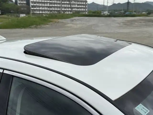 日産 スカイライン ハイブリッド GT タイプSP 兵庫県 2020(令2)年 6.3万km ブリリアントホワイトパール 純正ナビ/サンルーフ/全方位モニター/フルセグTV/Bluetooth接続可/ビルトインETC2.0/ドライブレコーダー/レーダークルーズコントロール/黒革シート/シートヒーター/パワーシート/リバース連動ドアミラー/純正19インチAW