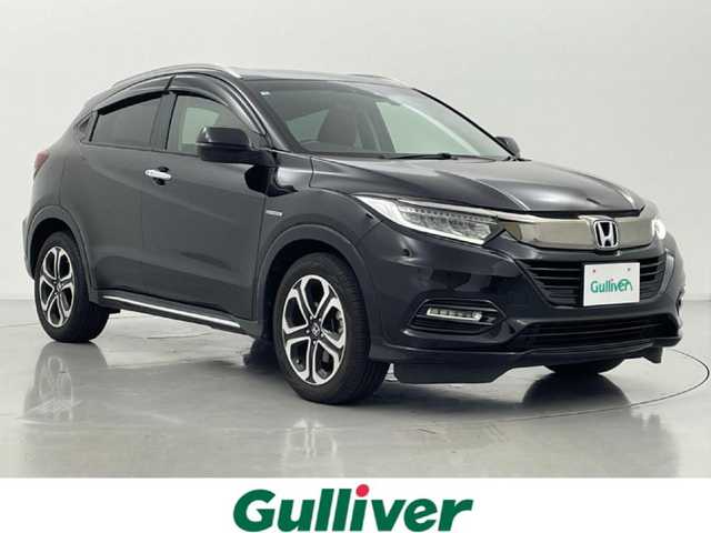 ホンダ ヴェゼル ハイブリッド Z ホンダセンシング 熊本県 2018(平30)年 6.9万km クリスタルブラックパール 禁煙車　/純正j9インチナビ（ＣＤ・ＤＶＤ・フルセグ・ＢＴ・ＳＤ）/バックカメラ　/純正前方ドライブレコーダー　/ビルトインＥＴＣ　/ホンダセンシング/・衝突軽減ブレーキ/・レーンキープアシスト/・アダブティブクルーズコントロール/横滑り防止/前席シートヒーター/ブラウンコンビシート/パドルシフト/純正フロアマット/純正１７インチAW/オートライト/LEDヘッドライト/フォグライト/スマートキー/プッシュスタート/スペアキー1本/保証書/取扱説明書