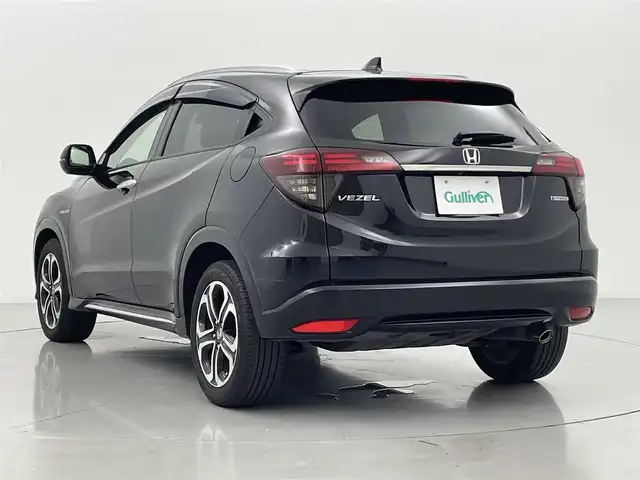 ホンダ ヴェゼル ハイブリッド Z ホンダセンシング 熊本県 2018(平30)年 6.9万km クリスタルブラックパール 禁煙車　/純正j9インチナビ（ＣＤ・ＤＶＤ・フルセグ・ＢＴ・ＳＤ）/バックカメラ　/純正前方ドライブレコーダー　/ビルトインＥＴＣ　/ホンダセンシング/・衝突軽減ブレーキ/・レーンキープアシスト/・アダブティブクルーズコントロール/横滑り防止/前席シートヒーター/ブラウンコンビシート/パドルシフト/純正フロアマット/純正１７インチAW/オートライト/LEDヘッドライト/フォグライト/スマートキー/プッシュスタート/スペアキー1本/保証書/取扱説明書